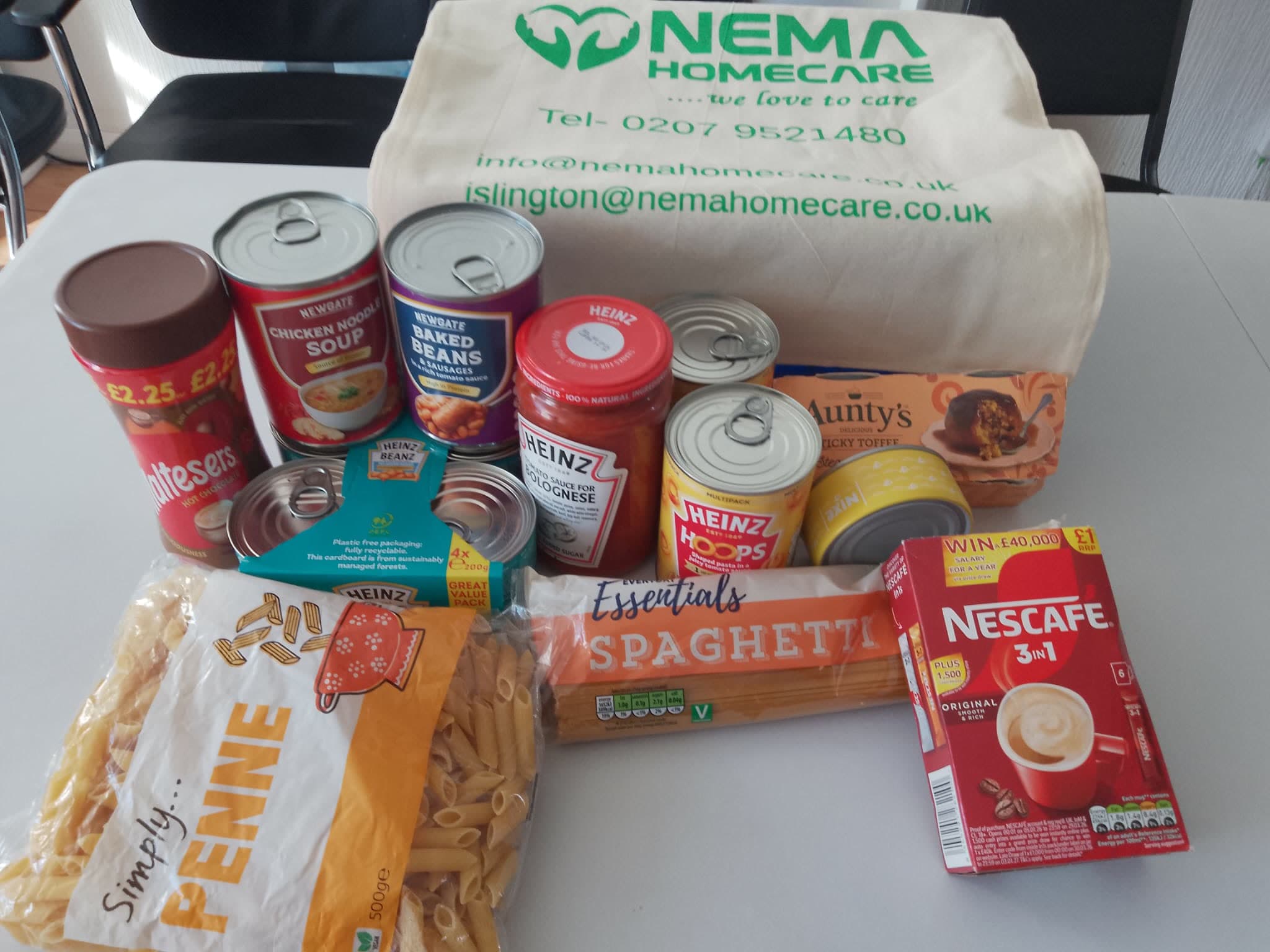 Tins, pasta and coffee unpacked in front of a Nema Home Care bag